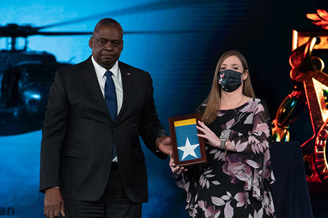 Secretary of the U.S. Army Christine E. Wormuth, Secretary of Defense Lloyd J. Austin III and Chairman of the Joint Chiefs of Staff U.S. Army Gen. Mark A. Milley present the Medal of Honor flag to Katherine Celiz, spouse of U.S. Army Sgt. 1st Class Christopher A. Celiz, during a Medal of Honor Induction Ceremony at Joint Base Myer-Henderson Hall, Va., Dec. 17, 2021. Sgt. 1st Class Celiz was posthumously awarded the Medal of Honor for actions of valor during Operation Freedom’s Sentinel while serving as a battalion mortar platoon sergeant with Company D, 1st Battalion, 75th Ranger Regiment, in Paktiya province, Afghanistan, on July 12, 2018. (U.S. Army photo by Laura Buchta)