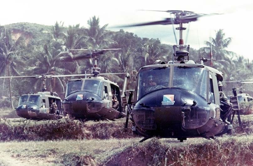 Bruce Crandall leading a formation of UH-1 helicopters from Alpha Company, 229th Aviation Regiment just prior to takeoff in Vietnam. 1966. Courtesy of Department of Defense.