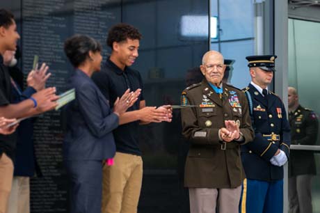 Medal of Honor recipient, retired U.S. Army Col. Paris Davis joined by his family and the Director of the Army Staff, Lt. Gen. Walter E. Piatt, during an engraving unveiling ceremony in his honor at the National Museum of the U.S. Army, Fort Belvoir, Va., Aug. 9, 2023. His name was permanently engraved in granite along the south wall of the Medal of Honor Garden to identify and honor him as one of the recipients of the nations highest award for valor. (U.S. Army photo by Bernardo Fuller)
