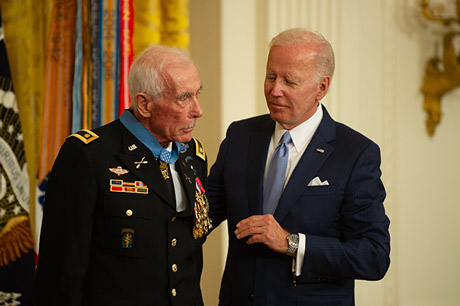 Retired U.S. Army Maj. John J. Duffy receives the Medal of Honor from President Joseph R. Biden in the East Room at The White House in Washington, D.C., July 5, 2022. Duffy distinguished himself by acts of gallantry and intrepidity above and beyond the call of duty, while serving as the Senior Advisor to the 11th Airborne Battalion, 2d Brigade, Airborne Division, Army of the Republic of Vietnam in the Republic of Vietnam, during the period of 14 to 15 April 1972. Duffy was awarded the Distinguished Service Cross for his actions on Dec. 1, 1972. On April 16, 2018, the Secretary of the Army recommended upgrade of his award to the Medal of Honor.  (U.S. Army photo by Sgt. Henry Villarama)
