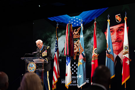 Secretary of Defense Lloyd J. Austin III presents the Medal of Honor flag to Army Maj. John J. Duffy, in a ceremony in which Duffy and five other Medal of Honor recipients were inducted into the Pentagon Hall of Heroes, at Joint Base Myer-Henderson Hall, Va., July 6, 2022. (U.S. Army photo by Sgt. Henry Villarama)
