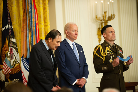 President Joe Biden stands the Dennis Fujii during the reading of a Medal of Honor citation at ceremony in the East Room of the White House on July 5, 2022. (U.S. Army photo by Sgt. Henry Villarama)