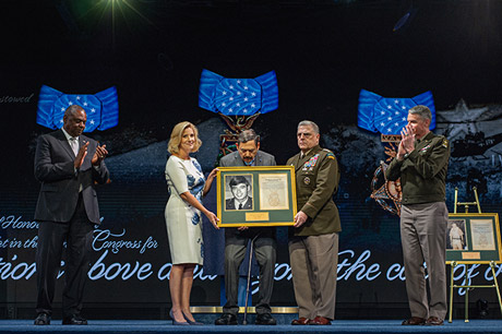 Secretary of the Army Christine Wormuth presents a photo and citation to Medal of Honor recipient former Army Spc. Five Dennis M. Fujii, in a ceremony in which Fujii and five other Medal of Honor recipients were inducted into the Pentagon Hall of Heroes, at Joint Base Myer-Henderson Hall, Va., July 6, 2022. (U.S. Army photo by Sgt. Henry Villarama)
