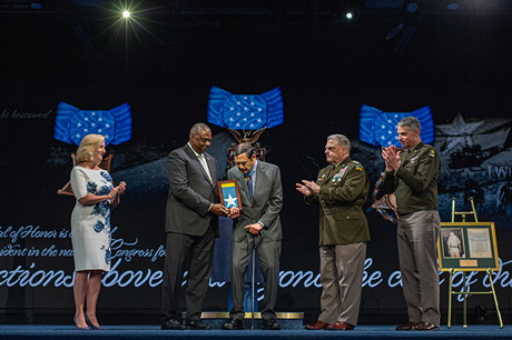 Secretary of Defense Lloyd J. Austin III presents the Medal of Honor flag to Medal of Honor recipient former Army Spc. Five Dennis M. Fujii, in a ceremony in which Fujii and five other Medal of Honor recipients were inducted into the Pentagon Hall of Heroes, at Joint Base Myer-Henderson Hall, Va., July 6, 2022. (U.S. Army photo by Sgt. Henry Villarama)
