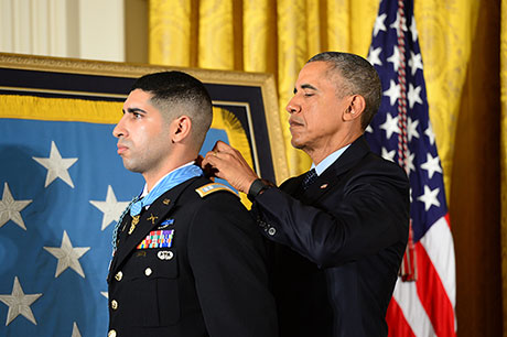 President Barack Obama hosts the Medal of Honor Ceremony for retired U.S. Army Capt. Florent Groberg at the White House in Washington D.C., Nov. 12, 2015. Groberg received the medal for actions during a combat engagement in Kunar province, Afghanistan, Aug. 8, 2012 while he was the commander of a personal security detail for the 4th Brigade Combat Team, 4th Infantry Division, when he and another Soldier, Sgt. Andrew Mahoney, identified and tackled a suicide bomber, saving the lives of the brigade commander and several others. (U.S. Army photo by Eboni L. Everson-Myart)