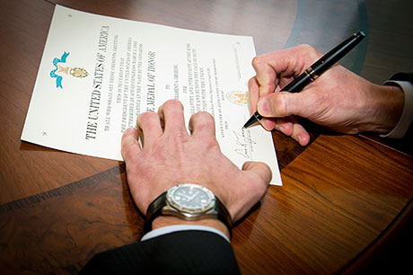 Acting Secretary of the Army Hon. Eric K. Fanning signs retired U.S. Army Capt. Florent Groberg's Medal of Honor certificate recognizing his heroism and selfless service to the nation. President Obama presented Groberg with the Medal of Honor at a White House ceremony Nov. 12, 2015. Groberg was inducted into the Pentagon's Hall of Heroes in a separate ceremony Nov.13, 2015, at the Pentagon, Arlington, Va. (U.S. Army photo by Mr. John G. Martinez)