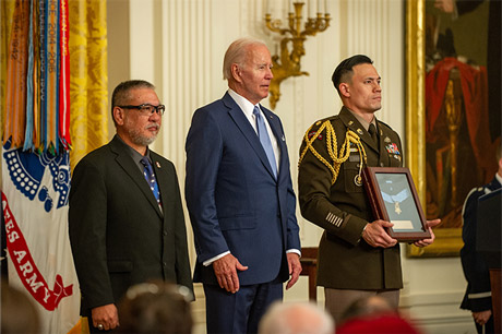 Mr. John Kaneshiro, the son of former U.S. Army Staff Sgt. Edward Kaneshiro, receives the Medal of
Honor from the president Joseph R. Biden in the East Room at the White House in Washington, D.C., July
5, 2022. Mr. Kaneshiro is receiving the award on behalf of his father’s acts of gallantry and intrepidity
above and beyond the call of duty while serving as an Infantry Squad Leader with Troop C, 1st Squadron,
9th Cavalry, 1st Cavalry Division near Phu Huu 2, Kim Son Valley, Republic of Vietnam. On July 25, 1963,
Kaneshiro was awarded the Distinguished Service Cross for his actions. On July 21, 2020, the Secretary of
the Army recommended the upgrade of his award to the Medal of Honor. (U.S. Army photo by Sgt.
Henry Villarama)