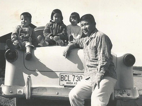 Tom (2), Naomi (5), Doris (3) pose with their father, Staff Sgt. Edward Kaneshiro at Tacoma, Washington in 1964. (Photo provided by Naomi Kaneshiro)