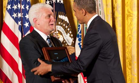 President Barack H. Obama shares a smile with Ray Kapaun, a nephew of former U.S. Army Capt. Emil J. Kapaun, during a Medal of Honor ceremony at the White House in Washington, D.C., April 11, 2013. The former chaplain was posthumously recognized for gallantry during the Korean War while serving with the 3rd Battalion, 8th Cavalry Regiment, 1st Cavalry Division from Nov. 1-2, 1950 in Unsan, Korea. (U.S. Army photo by Sgt. Laura Buchta/Released)