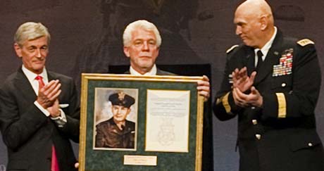 From left, Army Secretary John M. McHugh applaud during a ceremony to induct Medal of Honor recipient former Army Capt. Emil Kapaun into the Hall of Heroes at the Pentagon in Arlington, Va, April 12, 2013. Ray Kapaun, center, the chaplains nephew, represented his uncle, a chaplain who served in the Korean War, during the ceremony. Army Chief of Staff Gen. Ray Odierno, right, applauds. (U.S. Army photo by Spc. John G. Martinez/Released)