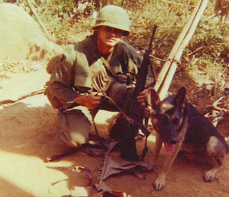 U.S. Army Pfc. James McCloughan poses with a dog while on a patrol in Vietnam, 1969. (Photo courtesy of former U.S. Army Spc. 5 James McCloughan)