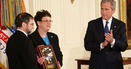 President George W. Bush leads the applause in honor of Private First Class Ross A. McGinnis, U.S. Army, after presenting the Congressional Medal of Honor posthumously to his parents, Tom and Romayne McGinnis, of Knox, Pennsylvania, during ceremonies Monday, June 2, 2008, at the White House. (White House photo by Chris Greenberg)