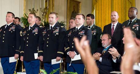 During the Medal of Honor presentation to the parents of Army Staff Sgt. Robert J. Miller on Oct. 6, 2010, the audience applauds Miller's teammates who were with him in Afghanistan when he died, Jan 25, 2008. (Photo Credit: Department of Defense)