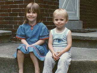 Staff Sergeant Robert Miller as a child with another child.