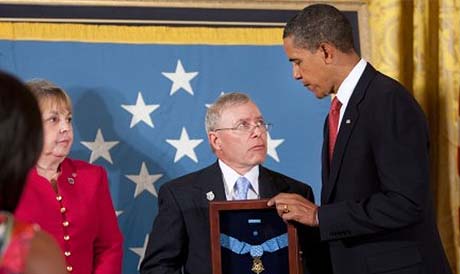 SFC Monti parents receive his Medal of Honor from President Barack Obama during a ceremony in the White House, September 17, 2009.