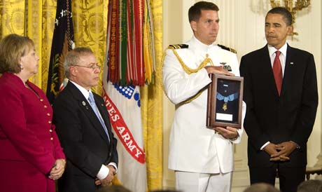 President Barack Obama posthumously awards Sgt. 1st. Class Jared C. Monti, from Raynham, Mass., the Medal of Honor to his parents, Paul and Janet Monti, in the East Room of the White House in Washington D.C., Sept. 17, 2009. (Photo Credit: U.S. Army)