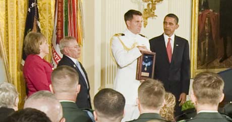 Attendees at a White House ceremony stand as President Barack Obama posthumously awards the Medal of Honor for Army Sgt. 1st. Class Jared C. Monti of Raynham, Mass., to his parents Paul and Janet Monti, Sept. 17, 2009. Army photo by D. Myles Cullen