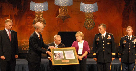 Hall of Heroes Induction - Outgoing Army Secretary Pete Geren presents Paul and Janet Monti with a plaque honoring their son Sgt. 1st Class Jared Monti, during Montis induction into the Pentagons Hall of Heroes. Sept. 18, 2009.