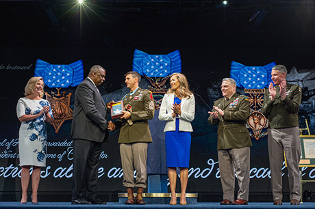 Secretary of Defense Lloyd J. Austin III presents the Medal of Honor flag to Army Sgt. Maj. Thomas P.
Payne, in a ceremony in which Duffy and five other Medal of Honor recipients were inducted into the
Pentagon Hall of Heroes, at Joint Base Myer-Henderson Hall, Va., July 6, 2022. (U.S. Army photo by Sgt.
Henry Villarama)