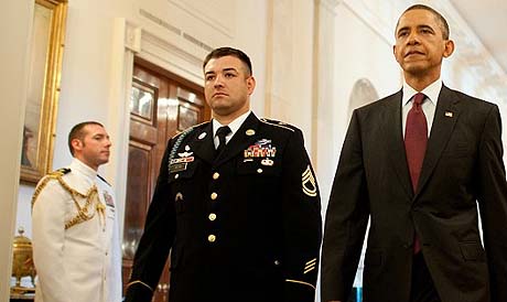 Heading to the East Room - President Barack Obama and Army Sgt. 1st Class Leroy Petry make their way into the East Room for a Medal of Honor presentation ceremony at the White House, July 12, 2011.