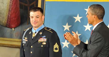 Petry receives the Medal of Honor - Medal of Honor recipient Sgt. 1st Class Leroy A. Petry receives a standing ovation from President Barack Obama and guests in the east room of the White House, July 12, 2011.