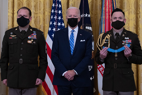 U.S. Army Master Sgt. Earl D. Plumlee stands as the citation is read before receiving the Medal of Honor from President Joseph R. Biden Jr. during a ceremony at the White House in Washington, D.C., Dec. 16, 2021. Master Sgt. Plumlee was awarded the Medal of Honor for actions of valor during Operation Enduring Freedom while serving as a weapon’s sergeant with Charlie Company, 4th Battalion, 1st Special Forces Group (Airborne), near Ghazni, Afghanistan, Aug. 28, 2013. (U.S. Army photo by Laura Buchta)