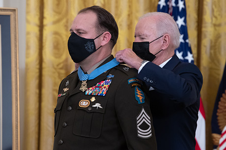 President Joseph R. Biden Jr. presents the Medal of Honor to U.S. Army Master Sgt. Earl D. Plumlee during a ceremony at the White House in Washington, D.C., Dec. 16, 2021. Master Sgt. Plumlee was awarded the Medal of Honor for actions of valor during Operation Enduring Freedom while serving as a weapon’s sergeant with Charlie Company, 4th Battalion, 1st Special Forces Group (Airborne), near Ghazni, Afghanistan, Aug. 28, 2013. (U.S. Army photo by Laura Buchta)