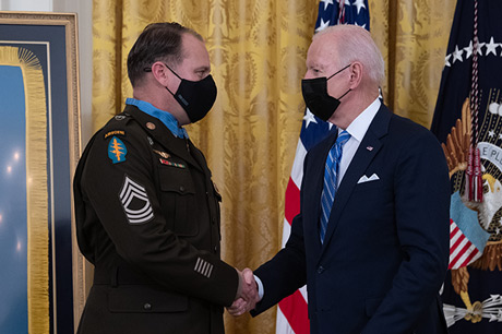 U.S. Army Master Sgt. Earl D. Plumlee shakes hands with President Joseph R. Biden Jr. during a Medal of Honor ceremony at the White House in Washington, D.C., Dec. 16, 2021. Master Sgt. Plumlee was awarded the Medal of Honor for actions of valor during Operation Enduring Freedom while serving as a weapon’s sergeant with Charlie Company, 4th Battalion, 1st Special Forces Group (Airborne), near Ghazni, Afghanistan, Aug. 28, 2013. (U.S. Army photo by Laura Buchta)