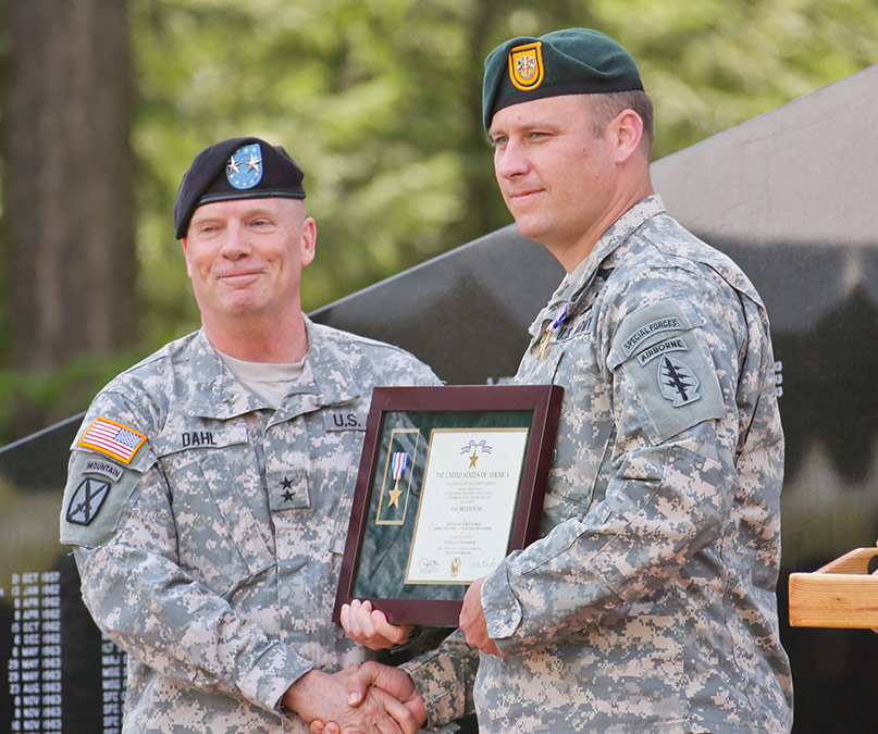 Then-Sgt. 1st Class Earl D. Plumlee, assigned to 1st Special Forces Group (Airborne), is presented the Silver Star Medal by Maj. Gen. Kenneth R. Dahl, I Corps Deputy Commanding General, during a ceremony at the 1st SFG (A), Joint Base Lewis-McChord, Wash. (Photo Credit: U.S. Army)