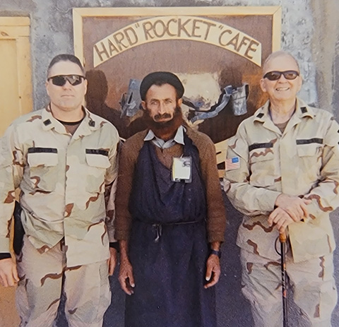 Retired Col. Ralph Puckett Jr. poses for a photo with then-Lt. Col. Jeff Bannister, 75th Ranger Regiment, and a local national friend, Afghanistan, 2005. Puckett was an honorary colonel of the 75th RR. (Photo courtesy of the Puckett Family)