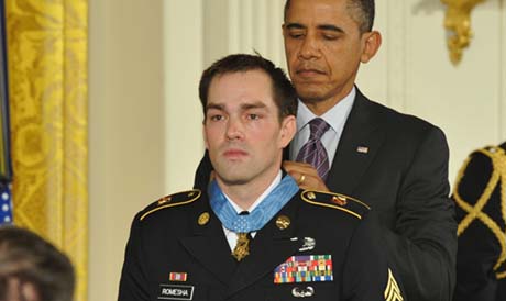 President Barack Obama awards the Medal of Honor to former Army Staff Sgt. Clinton Romesha during a ceremony in the East Room in Washington on February 11, 2013. Romesha is receiving the medal for his courageous actions while defending a combat outpost in Afghanistan in 2009. (Photo Credit: U.S. Army)