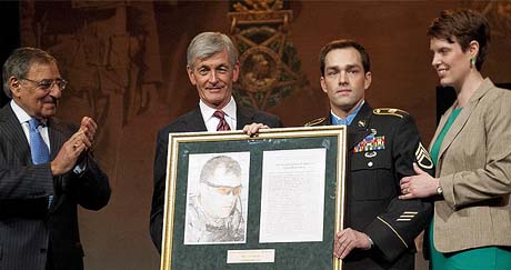 From left, Defense Secretary Leon Panetta and Secretary of the Army John McHugh present a Hall of Heroes induction plaque to former U.S. Army Staff Sgt. Clinton L. Romesha and his wife, Tamara, during a ceremony at the Pentagon in Arlington, Va., Feb. 12, 2013. Romesha, who was assigned to the 3rd Squadron, 61st Cavalry Regiment, 4th Brigade Combat Team, 4th Infantry Division, was recognized for actions Oct. 3, 2009 during a firefight at Combat Outpost Keating in northeastern Afghanistan