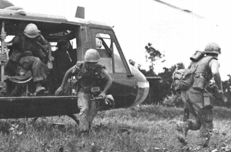 Troops leaving UH-1 copter during Vietnam War. September 1971. Photo by Lieutenant W. H. Baker, Courtesy of Naval Weapons Laboratory, Department of Defense.