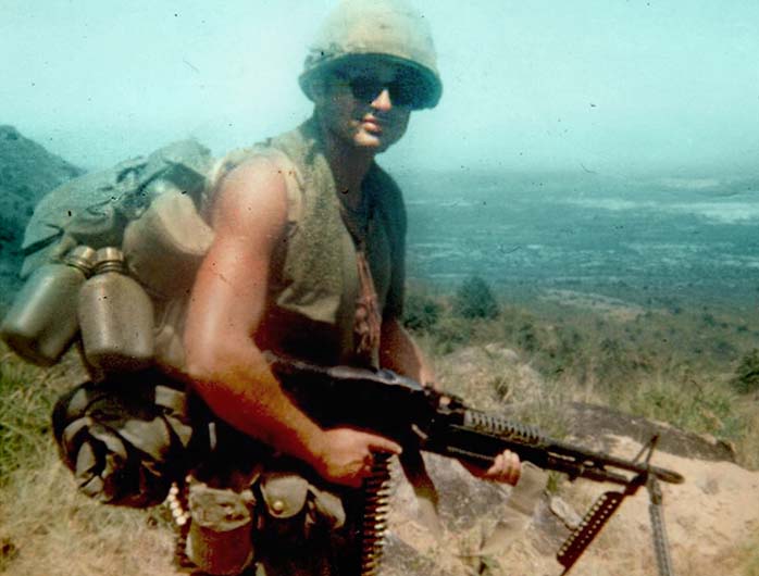 Spc. 4 Leslie H. Sabo Jr. carries the M-60 machine gun in 1969. Photo Courtesy of U.S. Army  