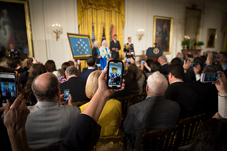 President Barack Obama bestows the Medal of Honor to Sgt. William Shemin, accepting on his behalf are his daughters, Elsie Shemin-Roth (middle) and Ina Bass (left), in the East Room of the White House, June 2, 2015. Shemin, a Jewish-American, distinguished himself as a member of 2nd Battalion, 47th Infantry Regiment, 4th Infantry Division, American Expeditionary Forces, during combat operations against the enemy on the Vesle River, near Bazoches, France, during World War I. While serving as a rifleman from August 7-9, 1918, Shemin left the cover of his platoon's trench and crossed open space in full sight of the Germans, repeatedly exposing himself to heavy machine gun and rifle fire to rescue the wounded. After officers and senior noncommissioned officers had become casualties, Shemin took command of the platoon and displayed great initiative under fire, until he was wounded, Aug. 9. Shemin was wounded by shrapnel and a machine-gun bullet that pierced his helmet that was lodged behind his left ear, leaving him partially deaf. 
U.S. Army photo by Staff Sgt. Bernardo Fuller