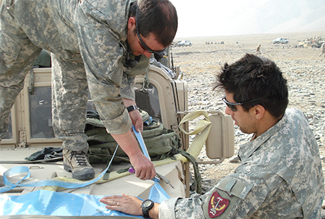 Then-Staff Sgt. Ronald J. Shurer (left) and then-Staff Sgt. Luis Morales preparing for a mission, Afghanistan, Nov. 2007. Photo courtesy of Ronald J. Shurer II.