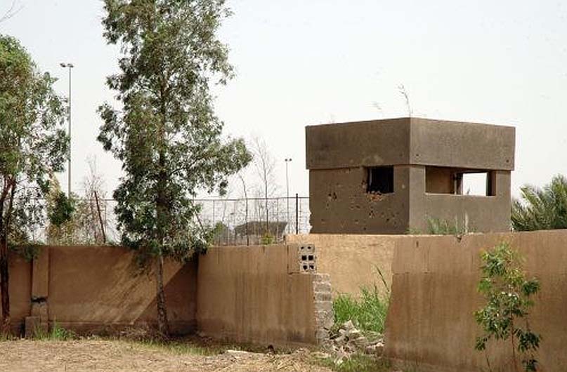 Sgt. 1st Class Smith's view from his position in the courtyard. Iraqi troops were firing from the tower on the left, and climbing over the wall in front.