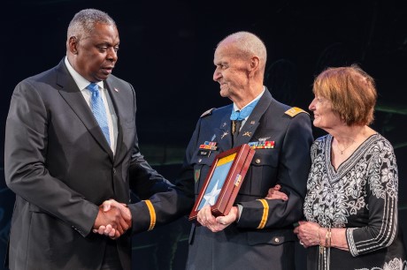 Secretary of Defense Lloyd Austin III presents the Medal of Honor flag to former U.S. Army Capt. Larry L. Taylor during the Hall of Heroes Induction Ceremony and Virtual Medal of Honor Wall Museum Unveiling, at Conmy Hall, Joint Base Myer-Henderson Hall, Virginia, Sept. 6, 2023. Taylor was inducted into the Hall of Heroes for his acts of gallantry and intrepidity above and beyond the call of duty while serving as then-1st Lt. Taylor, a team leader assigned to Troop D (Air), 1st Squadron, 4th Cavalry, 1st Infantry Division, near the hamlet of Ap Go Cong, Republic of Vietnam, June 18, 1968. (U.S. Army photo by Christopher Kaufmann)
