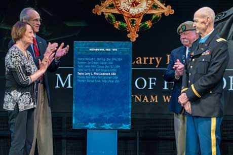 Medal of Honor recipient, former U.S. Army Capt. Larry L. Taylor and his wife, Toni, unveil a plaque bearing Taylors name during the Hall of Heroes Induction Ceremony and Virtual Medal of Honor Wall Museum Unveiling, at Conmy Hall, Joint Base Myer-Henderson Hall, Virginia, Sept. 6, 2023. Taylor was inducted into the Hall of Heroes for his acts of gallantry and intrepidity above and beyond the call of duty while serving as then-1st Lt. Taylor, a team leader assigned to Troop D (Air), 1st Squadron, 4th Cavalry, 1st Infantry Division, near the hamlet of Ap Go Cong, Republic of Vietnam, June 18, 1968. (U.S. Army photo by Christopher Kaufmann)
