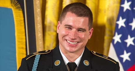 Former Army Sgt. Kyle J. White laughs as the President talks about his family during the Medal of Honor ceremony at the White House, Washington, D.C., May 13, 2014. White is being awarded the Medal of Honor for his actions while on a dismounted movement in the mountainous terrain in Aranas, Afghanistan, Nov. 9, 2007. (U.S. Army Photo by Sgt. Mikki L. Sprenkle/Released)