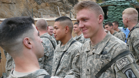 1st Lt. Matthew C. Ferrara awards Spc. Kain Schilling the Combat Infantryman Badge, during a ceremony in Nuristan Province, Afghanistan, Nov. 6, 2007. The CIB is awarded to Infantry or Special Forces Soldiers who actively engage in ground combat with...