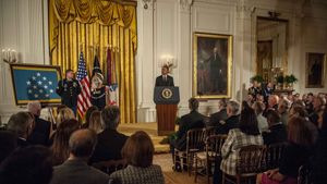 Former Sgt. Kyle J. White looks at President Barack Obama as the President talks about his heroic actions on Nov. 9, 2007, during the Medal of Honor ceremony at the White House, May 13, 2014. White is being awarded the Medal of Honor for his actions ...