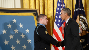 President Barack Obama congratulates former Sgt. Kyle White after presenting him the Medal of Honor during a ceremony at the White House in Washington, D.C., May 13, 2014. White was awarded the Medal of Honor for his actions in Aranas, Afghanistan, N...