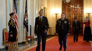 President Barack Obama and formerSgt. Kyle White arrive to the East Room of the White house for a Medal of Honor ceremony, May 13, 2014.  White was recognized for his actions during his deployment to Afghanistan in 2007 while serving with Chosen Comp...