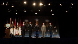 Deputy Defense Secretary Bob Work, far left, presides over a ceremony to induct former Army Sgt. Kyle J. White, center, the most recent Medal of Honor recipient, into the Hall of Heroes at the Pentagon, May 14, 2014. Army Chief of Staff Gen. Ray Odie...