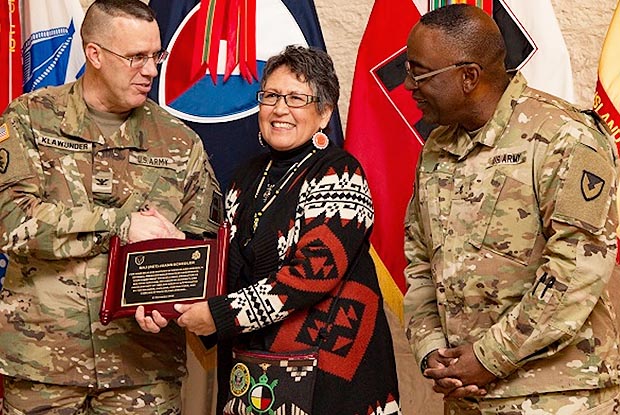 slideshow preview image - Col. Shawn E. Klawunder, First Army’s chief of staff, presents a plaque