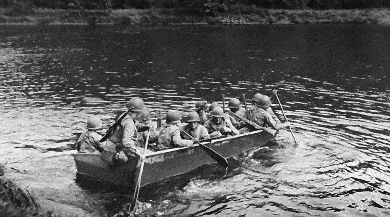 Image: members of 2d Battalion, 11th Infantry, cross the river at Dornot during World War II