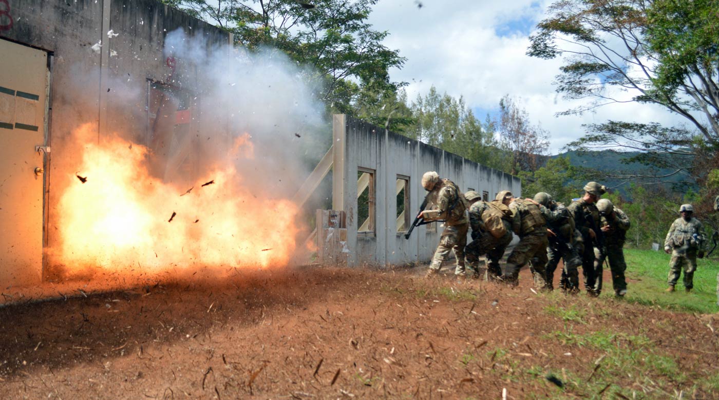 Image: Combat engineers assigned with 29th Brigade Engineer Battalion, 3rd Brigade Combat Team, 25th Infantry Division, and Marines assigned with 2nd Battalion, 3rd Marine Regiment, brace themselves during a live explosive door breaching at Schofield Barracks