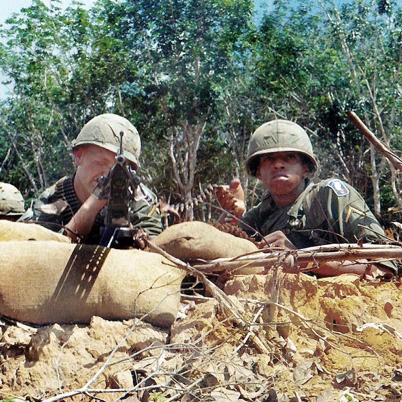 Soldiers in trench with M60