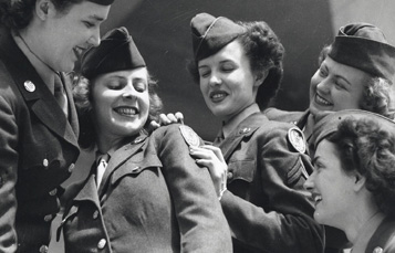 Air WACs in WWII with new 15th AF shoulder sleeve insignia.